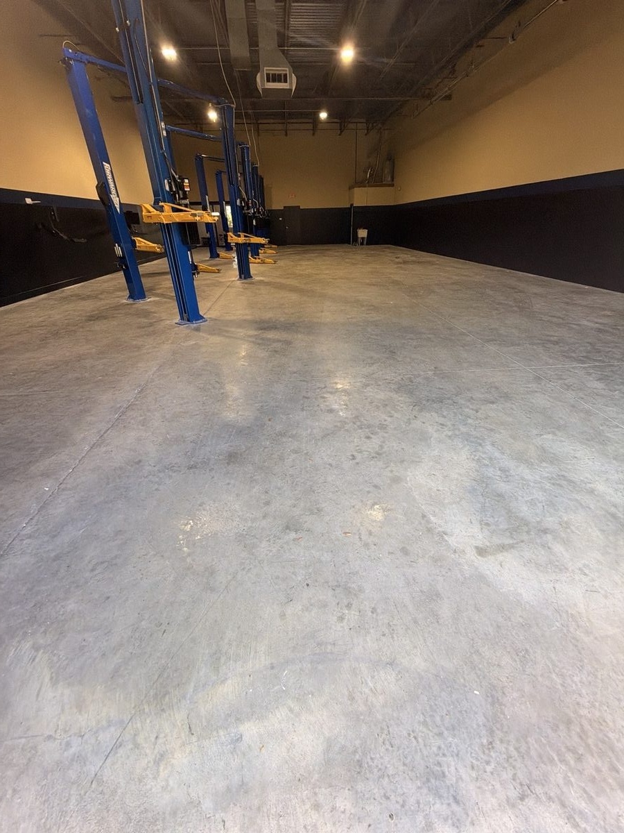 Auto shop before - bare concrete floor